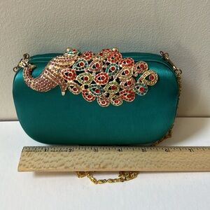 Jn’s  Evening bag with peacock embellishment.